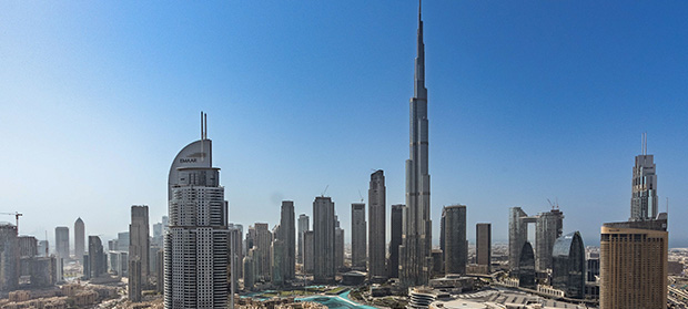Dubai Business Address Requirements Explained ‣ Sentinel Dubai Dubai skyline featuring the Burj Khalifa and Downtown Dubai under a clear blue sky.