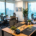 Furnished serviced office with desks, ergonomic chairs and floor-to-ceiling windows overlooking Dubai’s skyline.